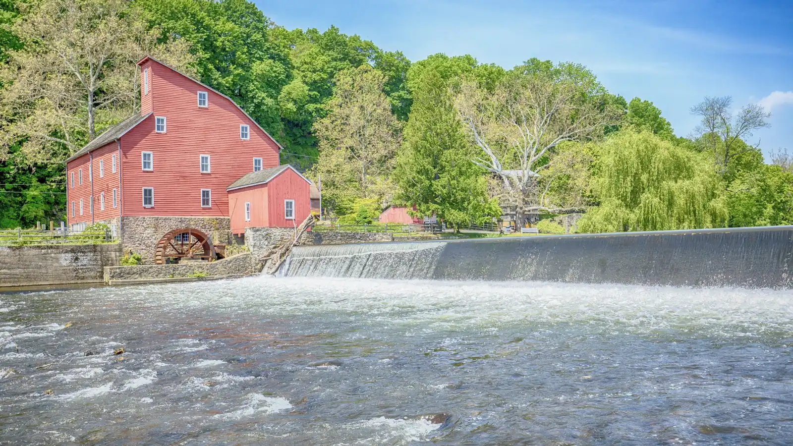 The Red Mill and its water wheel beside the dam on the South Branch Raritan River in Clinton, New Jersey